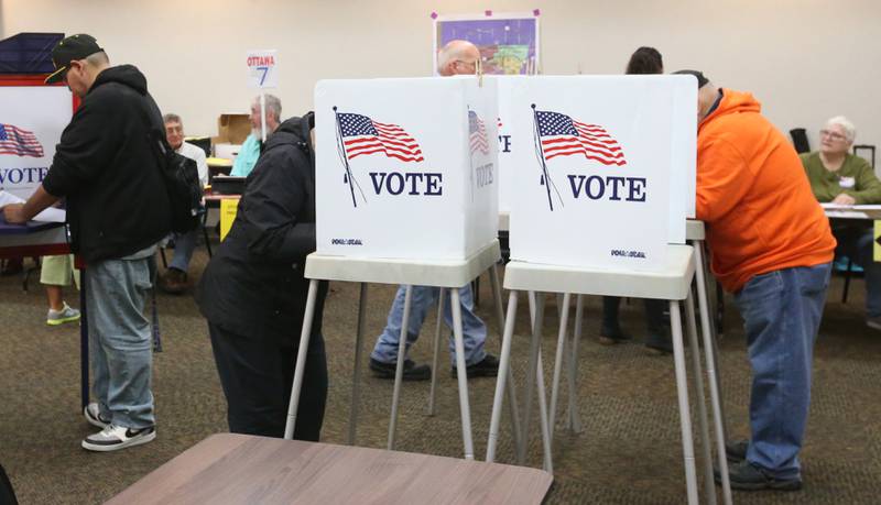 Voters fill out ballots on Tuesday, Nov. 5, 2024 at the Knights of Columbus Hall in Ottawa.