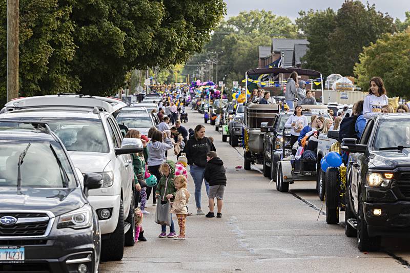 Supporters line the streets near Sterling High School Friday, Oct.6, 2023 as the homecoming parade moves through the neighborhood.