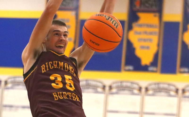 Richmond-Burton’s Jace Nelson polishes off a first-half slam dunk in varsity boys basketball onTuesday, Dec. 9, 2025, at Johnsburg High School in Johnsburg.