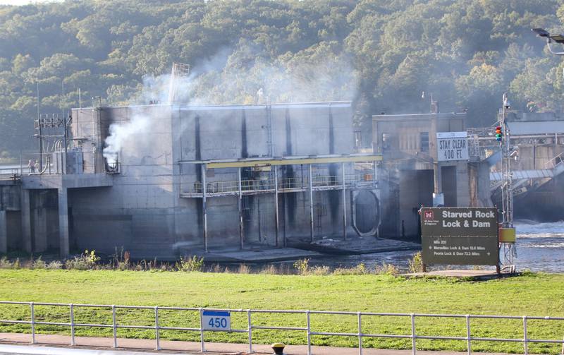 Fire crews work the scene of a fire at the Starved Rock hydroelectric power plant at the Starved Rock Lock and Dam on Tuesday, Oct. 3, 2023 near Utica. A MABAS box alarm was sent out just before 730a.m. for a working fire inside the plant.