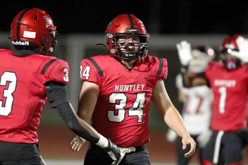 Huntley’s Haiden Janke celebrates a touchdown against Niles West in first-round Class 8A playoff football action at Huntley Friday.