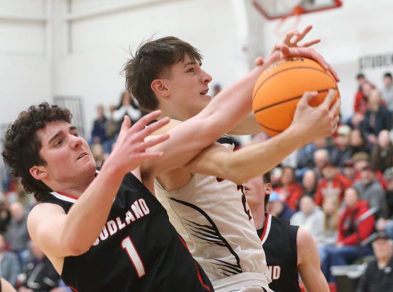Indian Creek's Jason Brewer grabs a rebound over Woodland's Brezdyn Simons during the Class 1A Sectional Semifinal game on Wednesday, March 4, 2026 at Amboy High School.