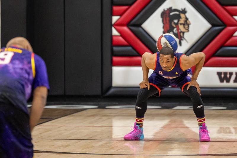 Devon “Livewire” Curry (8) of the Harlem Wizards balances ball on back of neck on Wednesday, April 16, 2025 at Woodland High School in Streator.