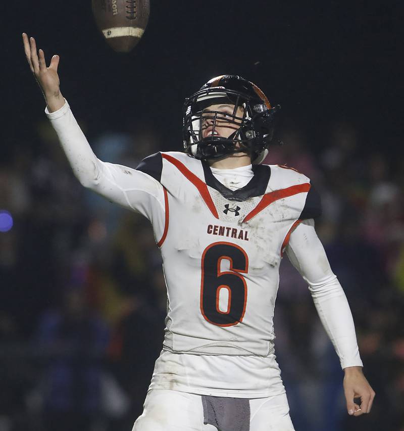 Crystal Lake Central's Abraham Quinn fields a bad snap during a Fox Valley Conference football game against Prairie Ridge  on Friday, Oct. 13, 2023, at Prairie Ridge High School in Crystal Lake.