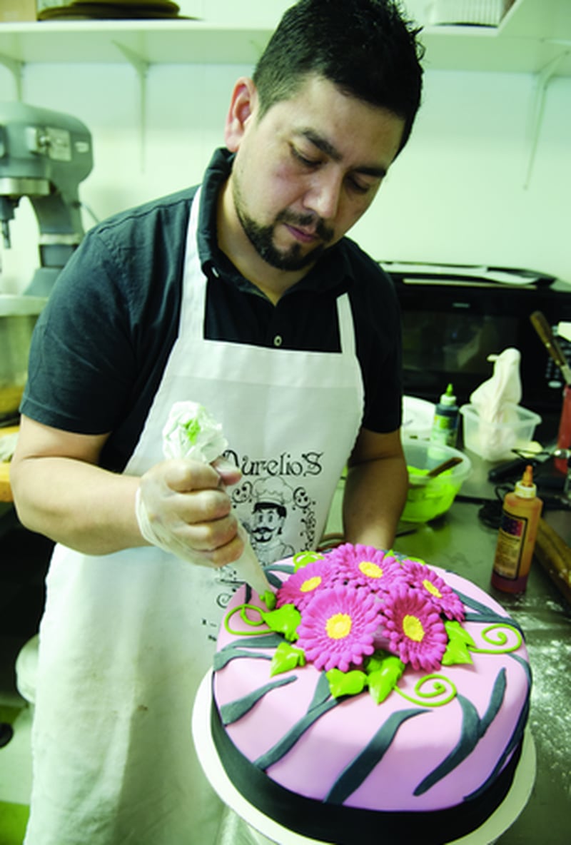 Aurelio Gallardo, 40, of Sterling, creates leaves for the flowers on a cake at his new bakery at 406 Ave. G in Sterling. Gallardo, who has a graphic artist’s background, makes cakes for any occasion, and also does fruit tables and pastry tables for events, special baskets with pastries, cookies and Mexican sweet rolls, and arrangements.
