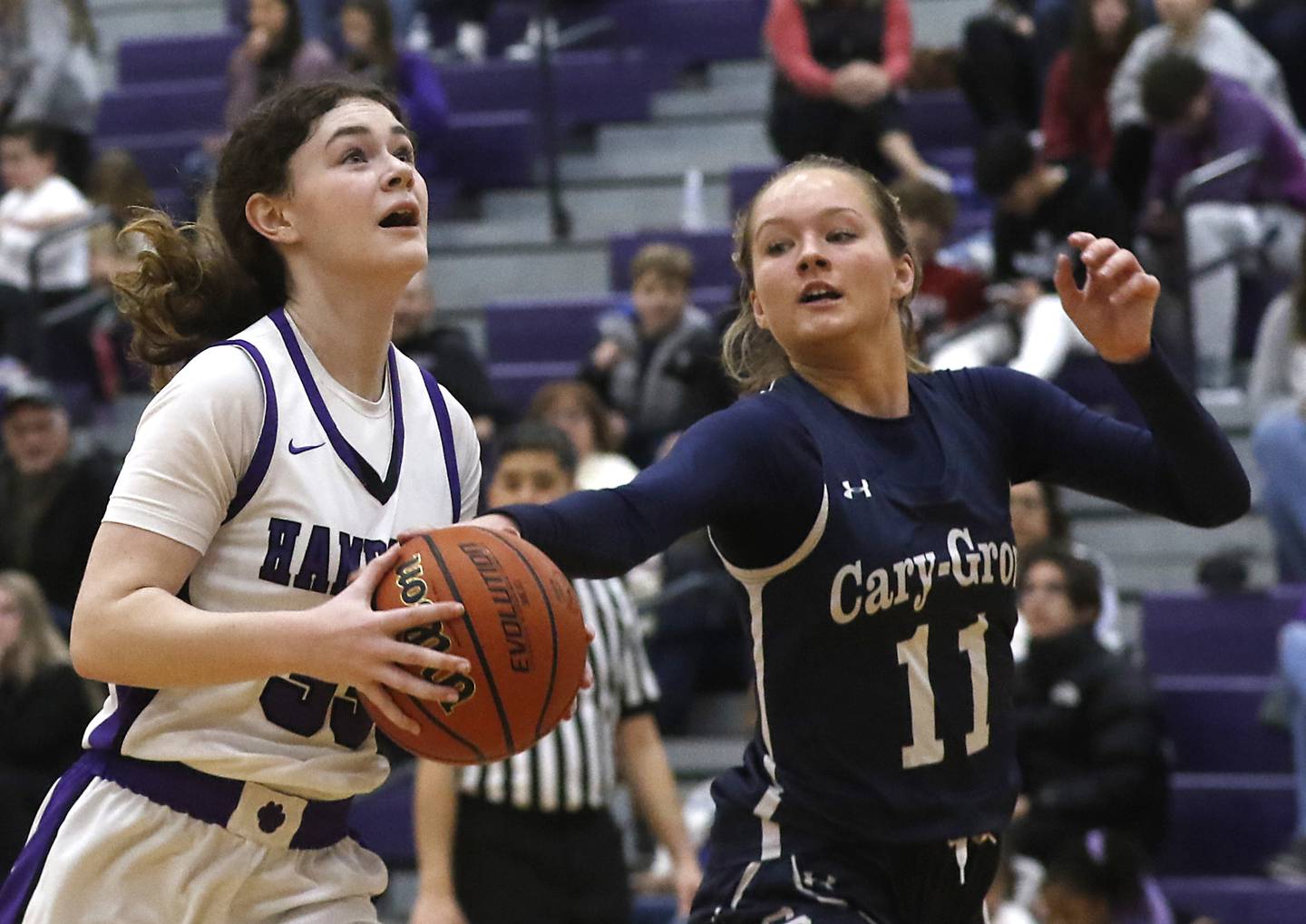 Cary-Grove's Kayli McMorris knocks the ball away from Hampshire's Ashley Herzing as she drives to the basket during a Fox Valley Conference girls basketball game Friday, Jan. 26, 2024, at Hampshire High School.