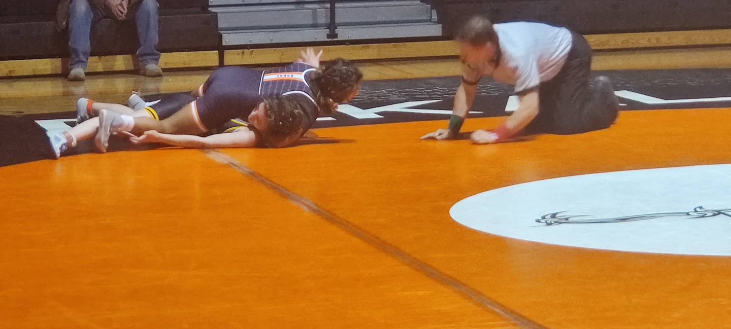 Alex Gregorio-Perez comes up with a pin Wednesday for DeKalb against Metea Valley.