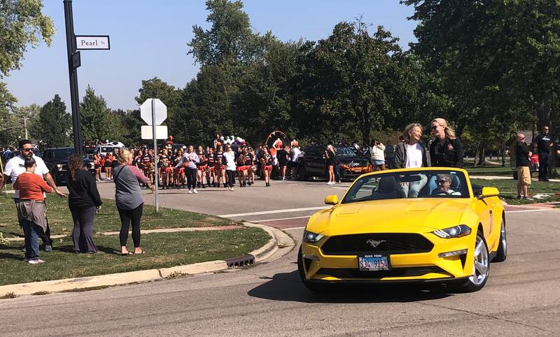 Grand marshal Erica Borggren kicks off the McHenry High School Homecoming parade Oct. 6, 2024.