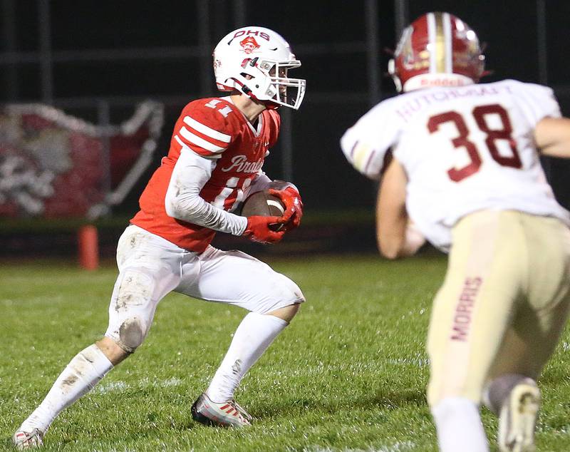 Ottawa's Weston Averkamp runs the ball as he is chased down by Morris's Hayden Hutchcraft on Friday, Oct. 13, 2023 at King Field.