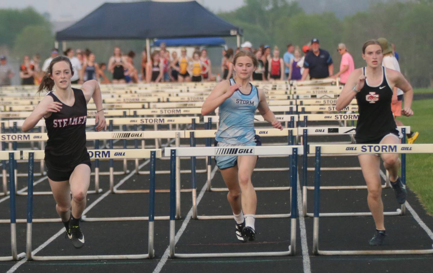 Fulton's Lara Bielema, Bureau Valley's Ashley Nordstrom and Indian Creek's Cheyenne Fay race in the 100-meter hurdles during the Class 1A Bureau Valley Sectional held Wednesday, May 11, 2022, at Bureau Valley High School in Manlius.