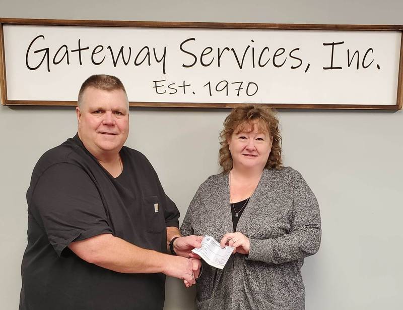 Jeff Peacock, grand knight of the Father Edward Farrell Knights of Columbus Council 5591 in Princeton, presented a check for $2,056.40 to Tracy Wright, CEO of Gateway Services.