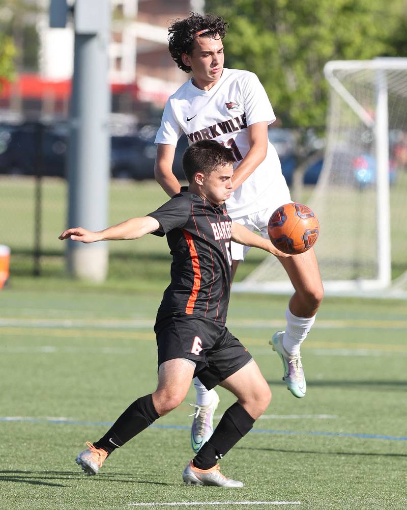 DeKalb's Landon Weishaar holds off Yorkville's Lukas Kleronomos during their game Thursday, Aug. 25, 2022, in the Barb Cup at the Northern Illinois University Outdoor Recreation Sports Complex.