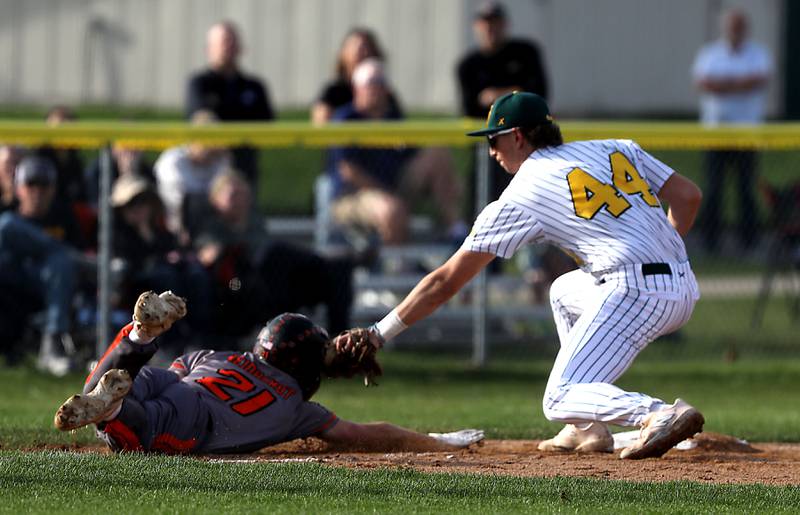 Crystal Lake South's Michael Silvius (right) tags out McHenry's Bennett Baumann as his picked off at third base during a Fox Valley Conference baseball game on Monday, April 13, 2026, at Crystal Lake South High School.