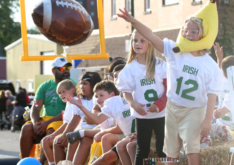 Spring Valley flag football players ride a float during the Hall High School Homecoming parade on Thursday, Sept. 28, 2023 in Spring Valley.