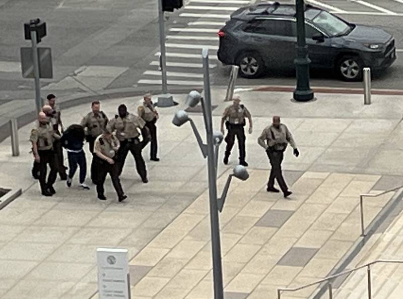 A group of Will County sheriff's deputies on Tuesday, Dec. 10, 2024, lead Patrick Conroyd, 42, to the Will County Courthouse in Joliet. Conroyd was arrested after fleeing the courthouse, according to the Will County Sheriff's Office.