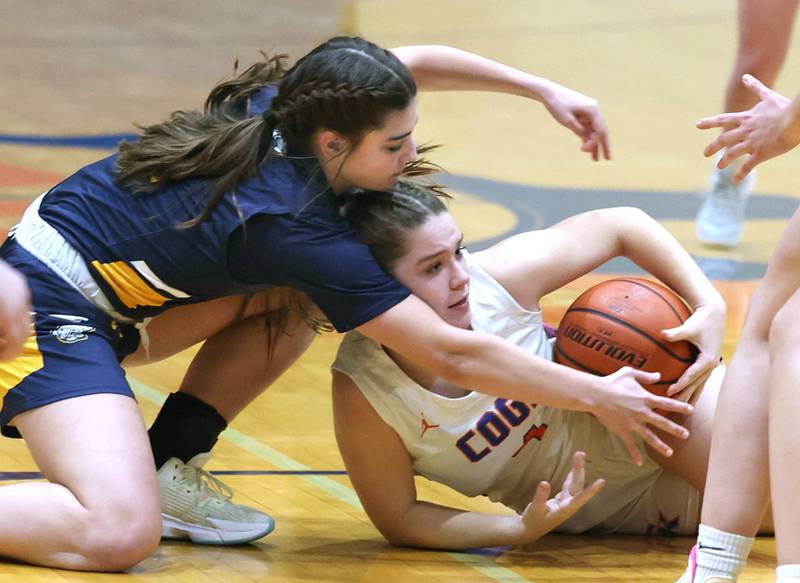 Polo’s Elsa Monoco and Genoa-Kingston's Sydney Hansen fight for a loose ball during their game Monday, Jan. 29, 2024, at Genoa-Kingston High School.