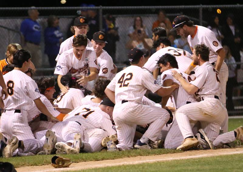Members of the Illinois Valley Pistol Shrimp baseball team celebrate after winning the Prospect League Championship against Rex on Wednesday, Aug. 7, 2024 at Schweickert Stadium in Peru.