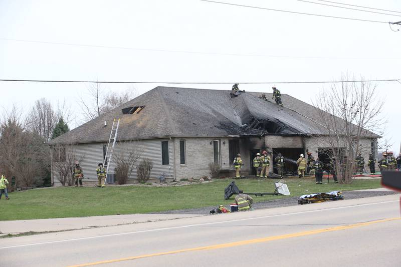 Firefighters work the scene of a structure fire in the 600 block of U.S. Route 6 on Tuesday, April 1, 2025 in La Salle. Fire departments from Peru, La Salle, Utica, Troy Grove, Wallace, Spring Valley and Oglesby were dispatched just before 2:30 to a one-story dublex home.