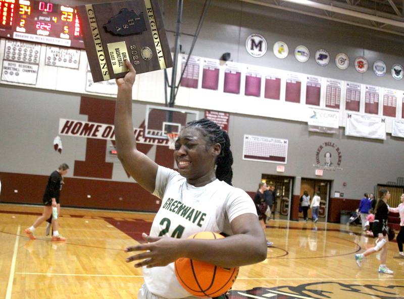 St. Edwards’ Sanaii McPherson reacts after receiving the title hardware in IHSA Regional Championship girls basketball on Thursday, Feb. 19, 2026, at Marengo High School in Marengo.