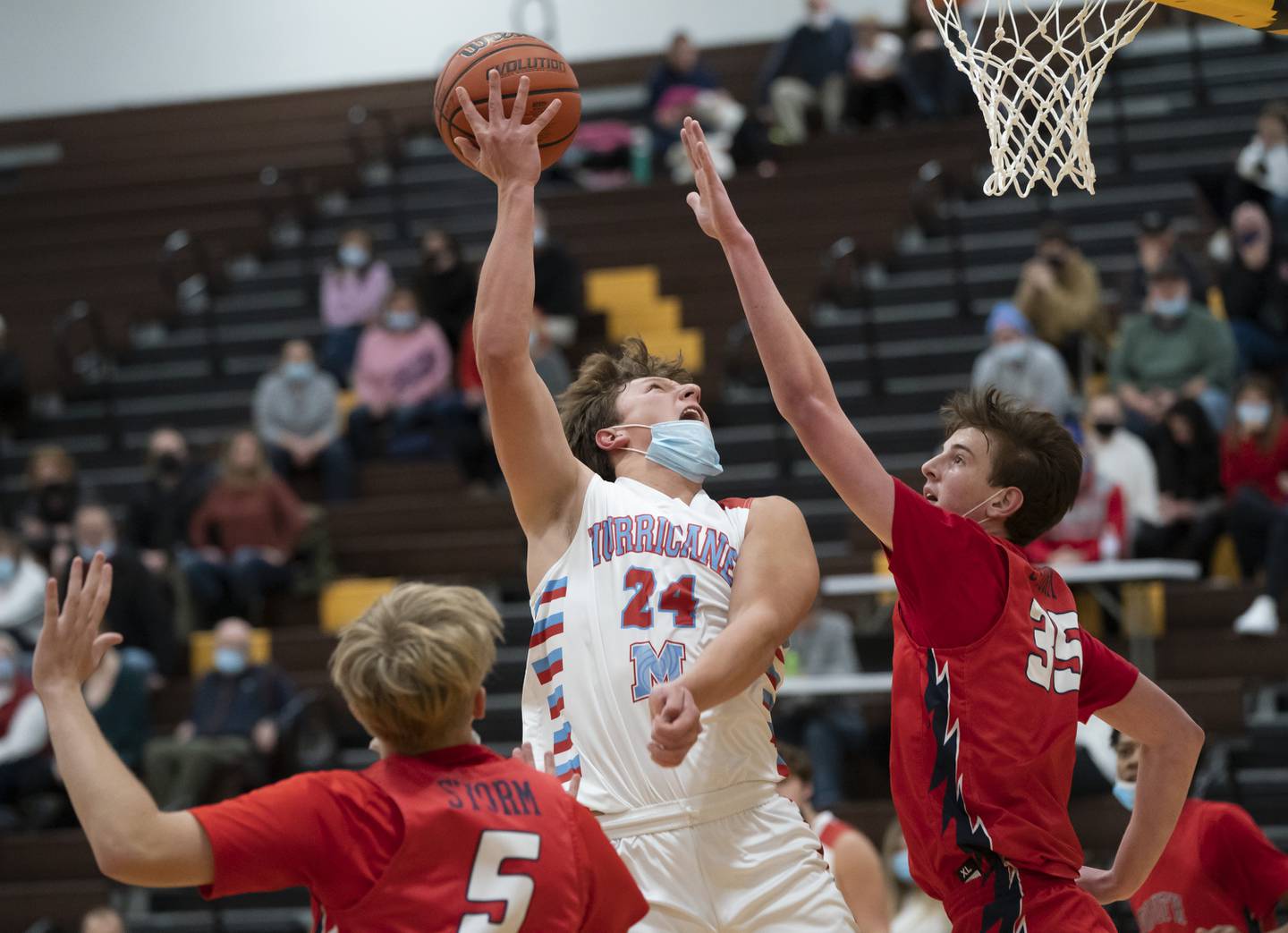 Marian Central's Christian Bentancur shoots over South Elgin's Michael Hankins during their game at the Hinkle Holiday Classic basketball tournament on Monday, December 27, 2021 at Jacobs High School in Algonquin.