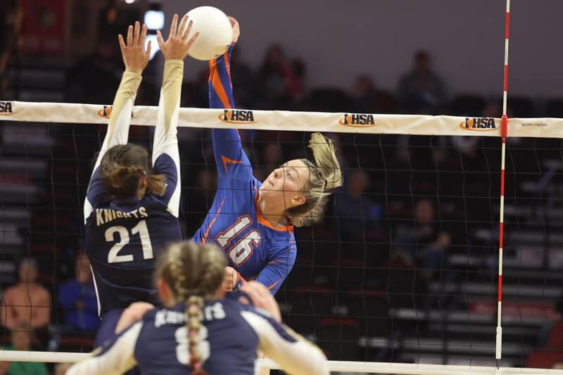 Genoa-Kingston’s Alayna Pierce stretches for the kill against IC Catholic in the Class 2A championship match on Saturday in Normal.