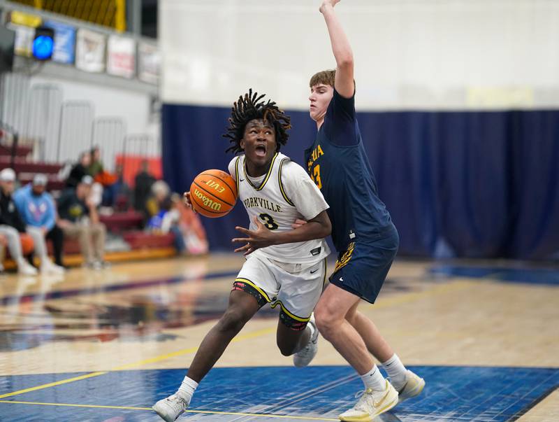 Yorkville Christian's Jayden Riley (3) drives to the basket against Neuqua Valley's Cole Kelly (23) during a basketball game at Yorkville Christian High School on Tuesday, February 4, 2025.