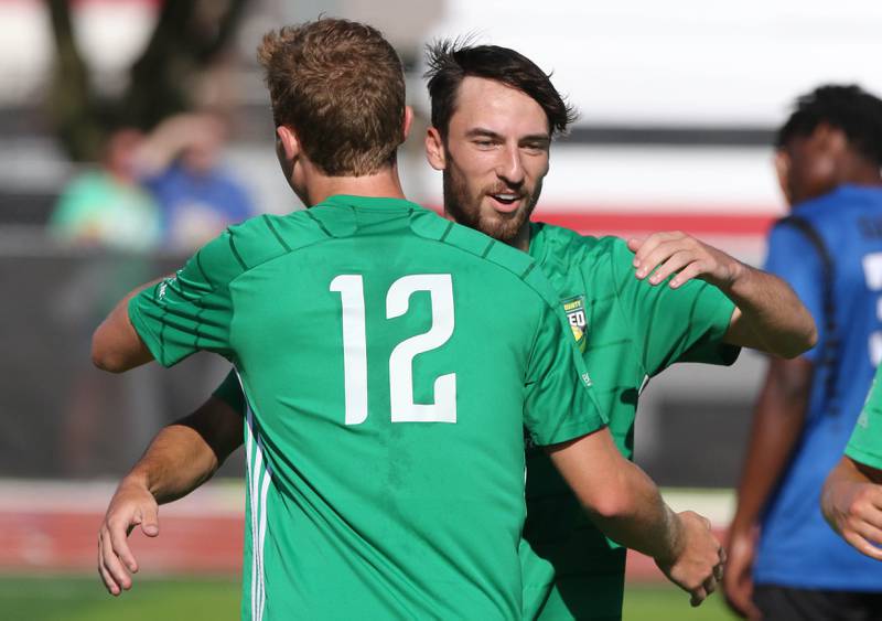 DeKalb County United's Josh Johansen (right) is congratulated by DeKalb County United's Aiden Westerberg after scoring against Rockford FC during their game Saturday, July 29, 2023, at the Soccer & Track and Field Complex at Northern Illinois University in DeKalb.