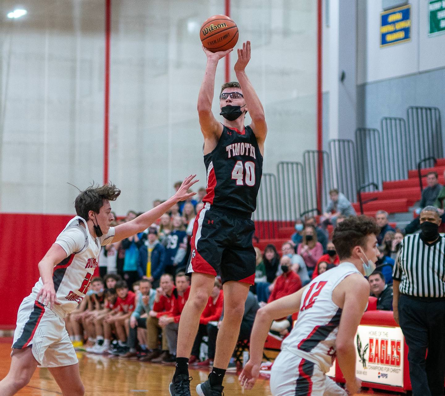 Timothy Christian's Ben VanderWal (40) shoots the ball against Aurora Christian during a basketball game at Aurora Christian High School on Tuesday, Jan 25, 2022.