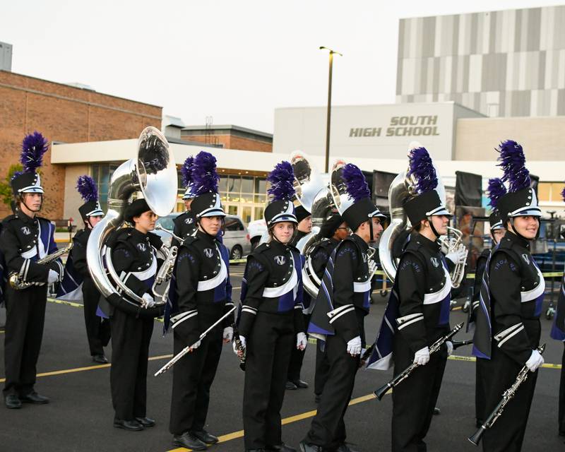 Downers Grove North band members make their way to the Downers Grove North football field on Saturday Oct. 5, 2024, during the Downers Grove South Mustangs Music Bowl.