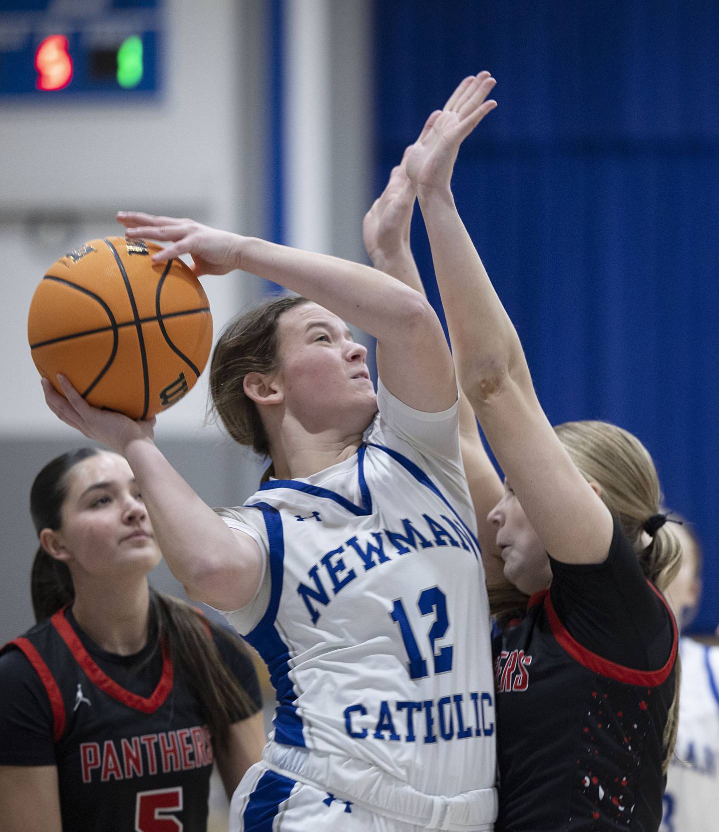Newman’s Lucy Oetting works to put up a shot against Erie-Prophetstown Thursday, Jan. 29, 2026.