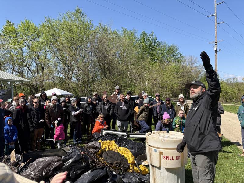Perfectly Flawed Foundation Founder Luke Tomsha speaks to volunteers during the 10th annual Earth Day cleanup at the I&M Canal’s Lock 14 on Saturday, April 18, in La Salle.