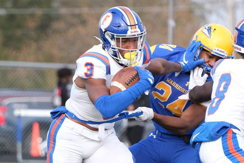 East St. Louis' Luther Burden III powers his way through the front line against Crete-Monee in the Class 6A semifinal game at Crete-Money High School. Saturday, Nov.20, 2021 in Crete.