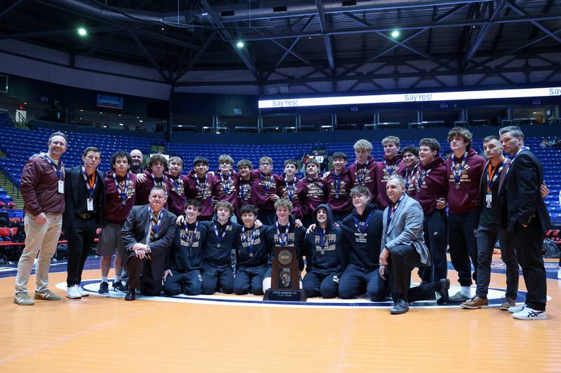 Montini poses with the IHSA Class 3A Dual Team State runner-up trophy following their loss to Marmion Academy in the championship on Saturday, Feb. 28, 2026.