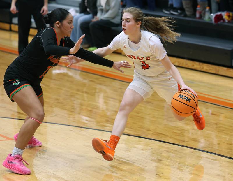 DeKalb's Olivia Schermerhorn  tries to go baseline against Plainfield East's Valeria  Ramos Thursday, Feb. 12, 2026, during their game at DeKalb High School.