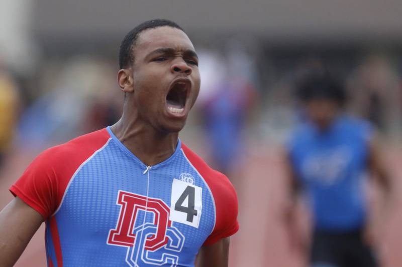 Dundee-Crown’s Oreoluwa Sobodu lets out a yell as his team wins the 4 x 100 meter relay during the Fox Valley Conference Boys Track and Field Meet on Thursday, May 9, 2024, at Huntley High School.