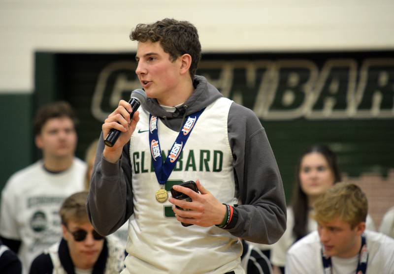 Glenbard West state basketball teammate Caden Pierce congratulates his team, the coaches and thanks the fans during the pep rally held Sunday March 13, 2022.