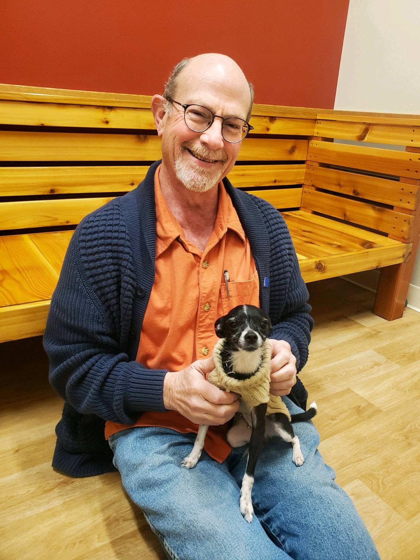 Lou Dolmon of the Woodstock area with Gizmo, the chihuahua dog that he and his wife Barbara adopted from Helping Paws Animal Shelter in Woodstock in 2023.