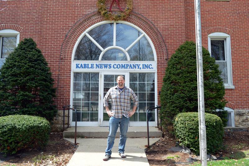 John Russell, of rural Mt. Morris, poses for a photo outside the former Kable News Company building on the Mt. Morris campus on April 20, 2023. Russell closed on the purchase of the building on March 1; he plans to restore and modify it into multi-use space that benefits the community.