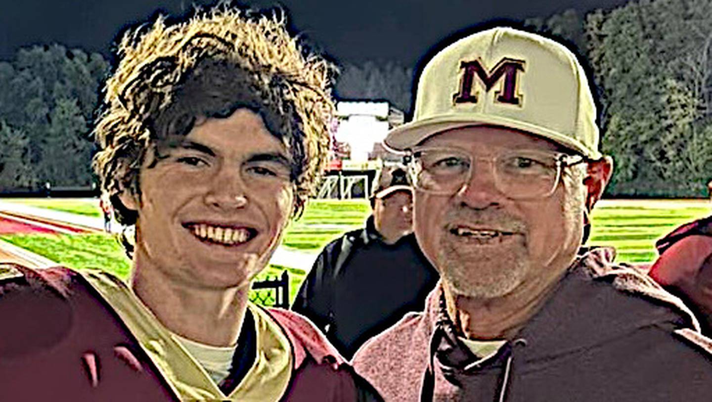 Morris' AJ Zweeres (left) poses with Frank Varner after a recent Morris win. Zweeres broke Varner's school record for career touchdown receptions.