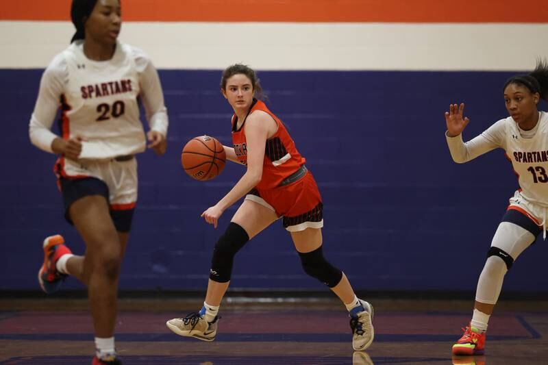 Minooka’s Kylie Loomis rolls out with the rebound against Romeoville on Tuesday January 24th, 2023.