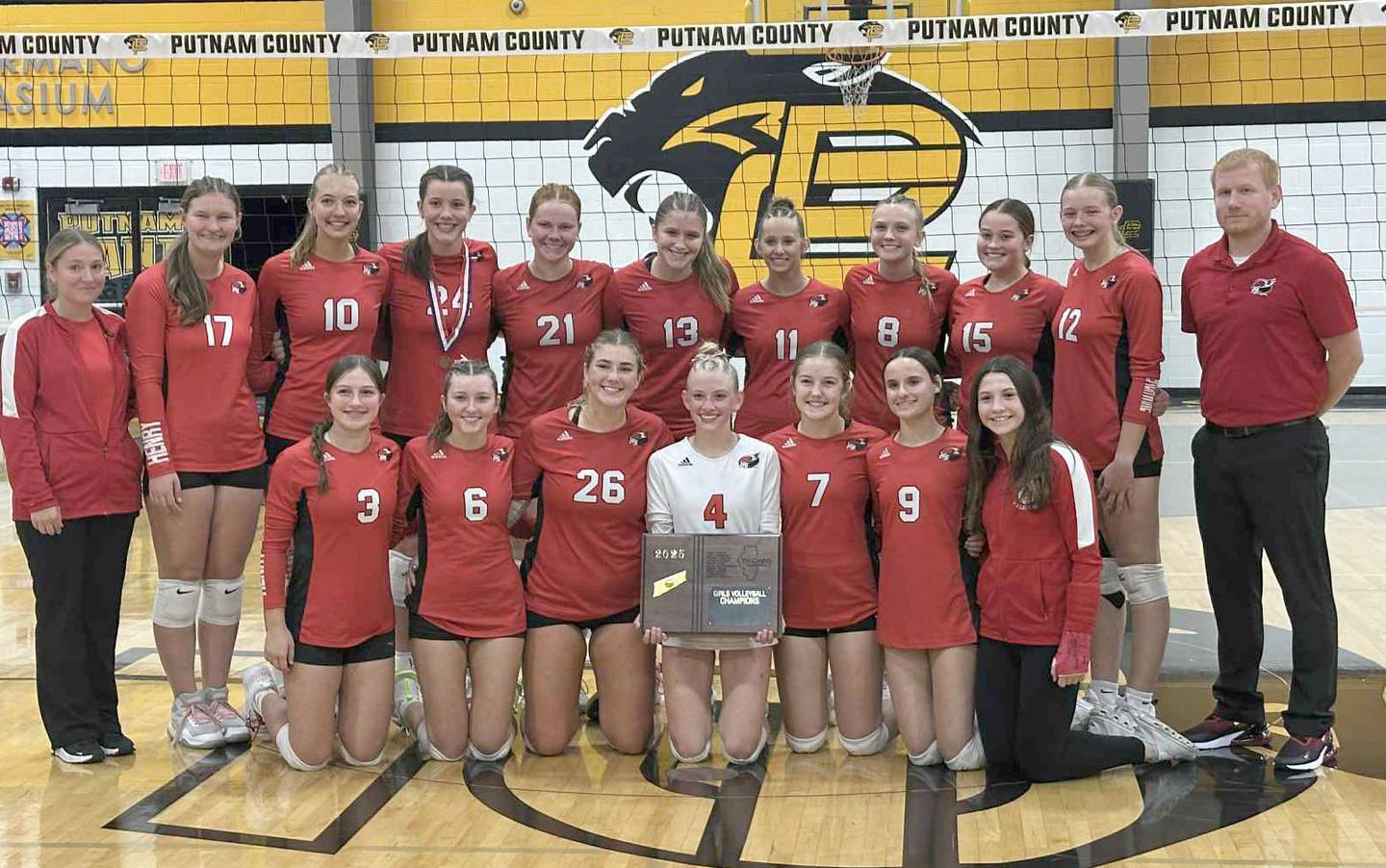 Members of the Henry-Senachwine volleyball team pose with the Tri-County Conference championship plaque on Thursday, Oct. 16, 2025 at Putnam County High School.
