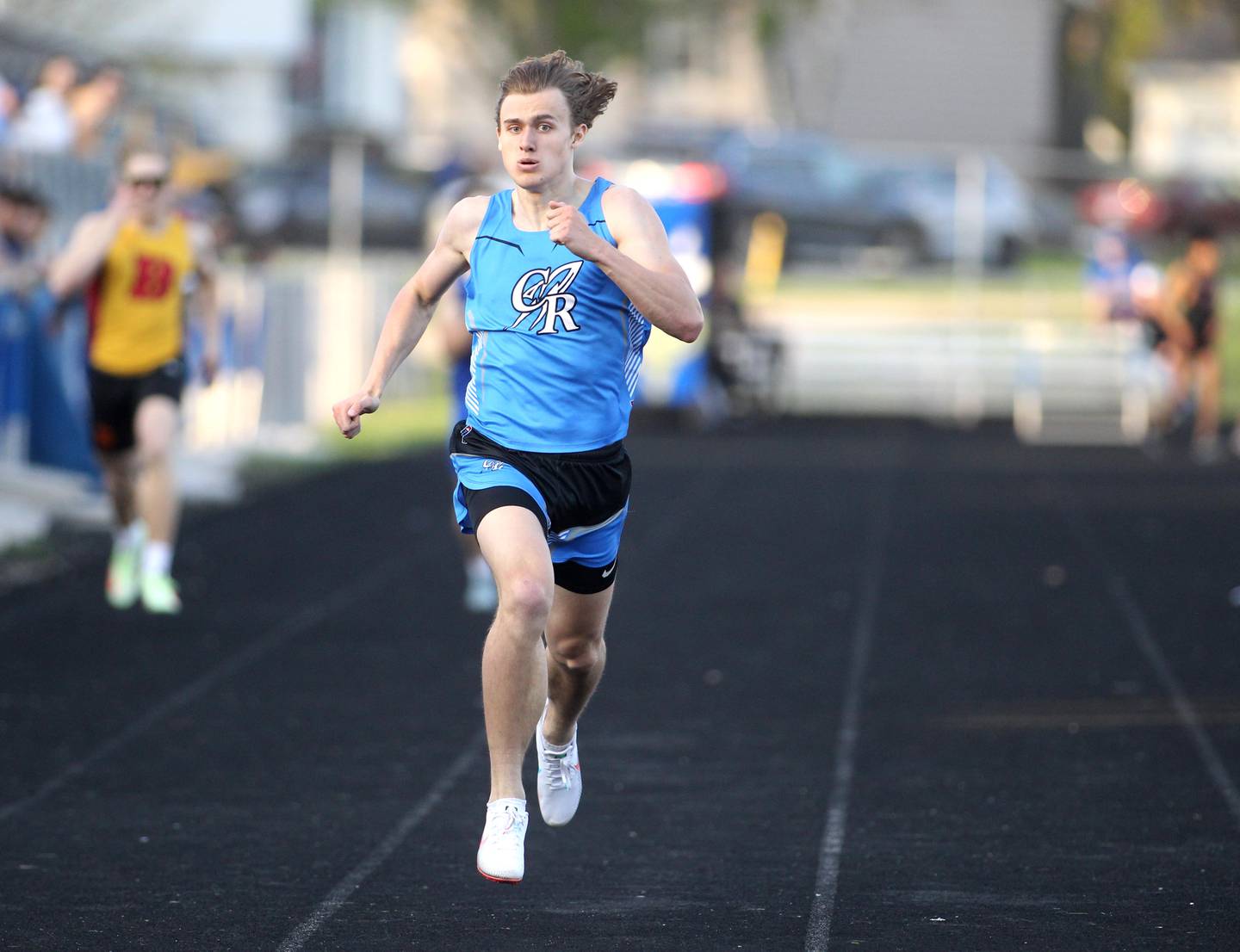 Burlington Central’s Zac Schmidt competes in the 400-meter run during the Kane County Boys Track and Field Invitational at Geneva High School on Monday, May 9, 2022.