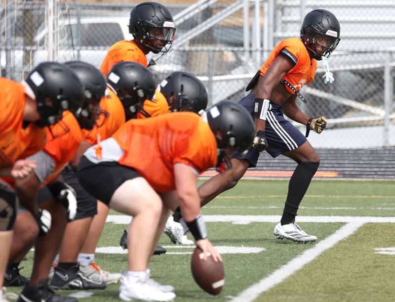 DeKalb’s Davon Grant (right) lines up for a play Wednesday, July 15, 2025, during a summer practice session at the school.