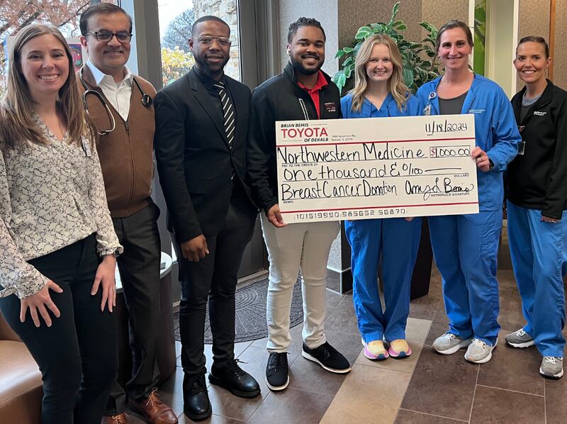 Brian Bemis Toyota of DeKalb employees present a donation of $2,000 to Northwestern Medicine Kishwaukee Cancer Center