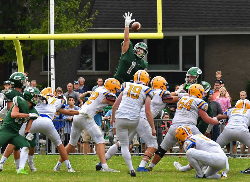 Ben Cesario (1) blocks a late fourth quarter field goal attempt by Lyons Township kicker Tommy Newcomb (19) to seal the Glenbard West win in a game on Sep. 16, 2023 at Glenbard West High School in Glen Ellyn.