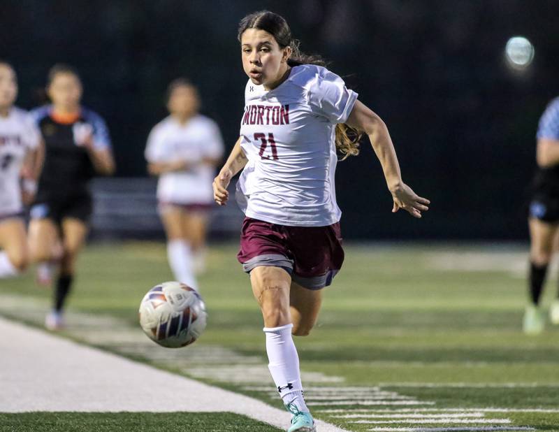 Morton's Carisma Rosales (21) chases the ball down the sidelines during soccer match between Morton at Willowbrook.  April 15, 2024.