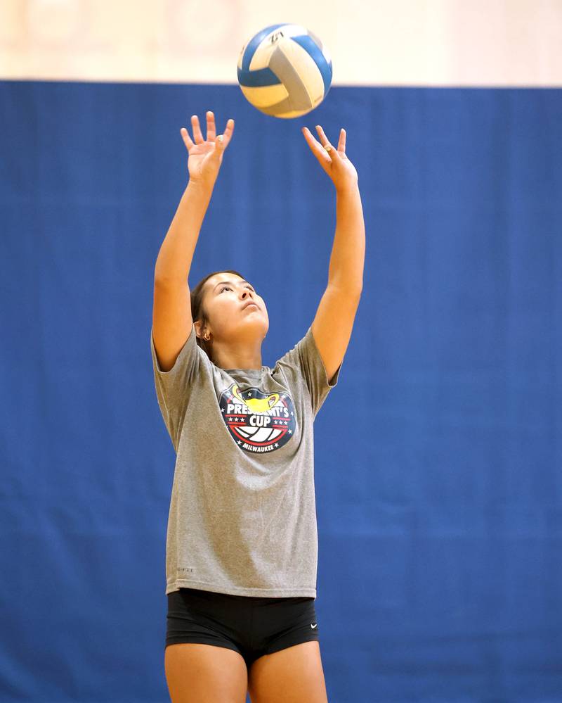 Genoa-Kingston’s Mia Wise sets the ball during practice Thursday, Aug. 10, 2023, at the school in Genoa.
