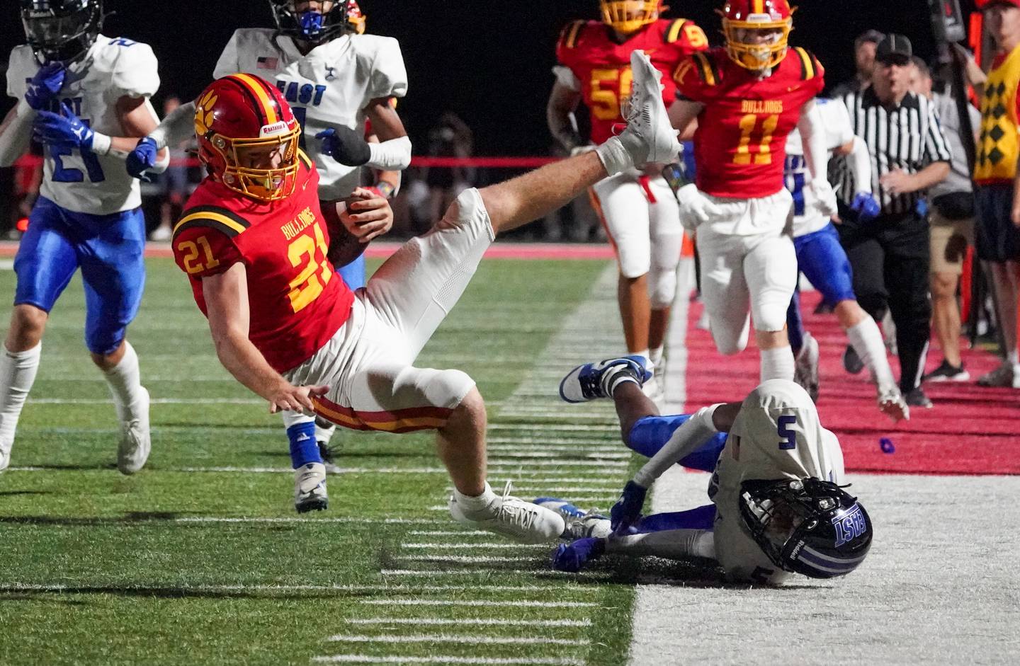 Lincoln-Way East's Jashawn Echols (5) upends Batavia’s Ryan Boe (21) during a football game at Batavia High School on Friday, Sep 1, 2023.