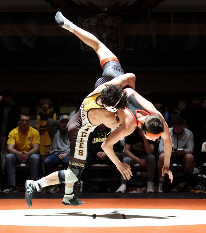 Crystal Lake Central’s Brandon Carbone and Jacobs’ Ben Arbotante go airborne at 132 pounds in varsity boys wrestling on Tuesday, Jan. 20, 2026 at Crystal Lake Central High School in Crystal Lake.