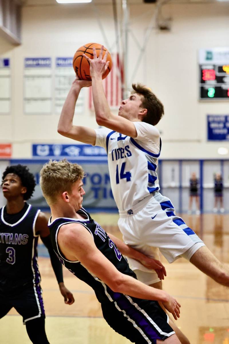 Princeton's Jackson Mason shoots over El Paso-Gridley's Elijah Webster Tuesday night at Prouty Gym. The Titans defeated the Tigers 75-59.